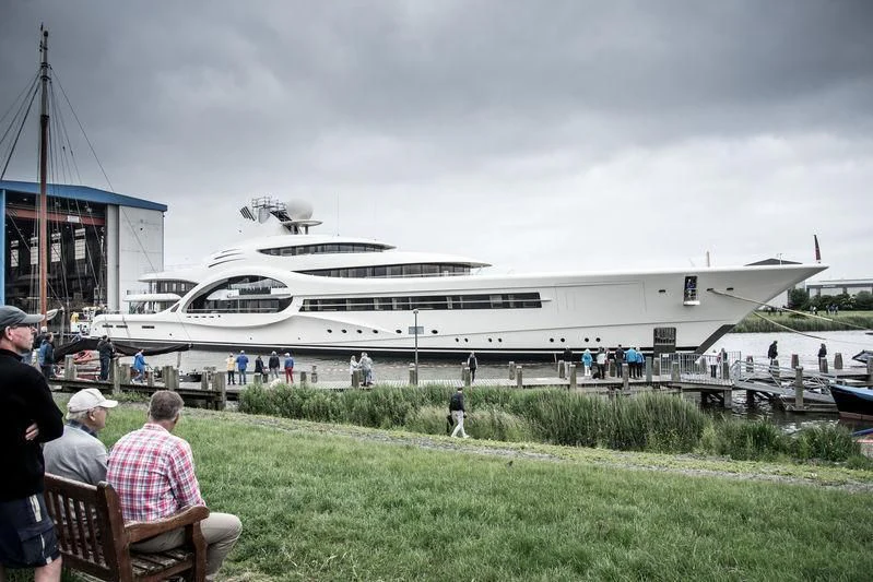 a large white boat in a harbor aboard AMBASSADOR Yacht for Sale