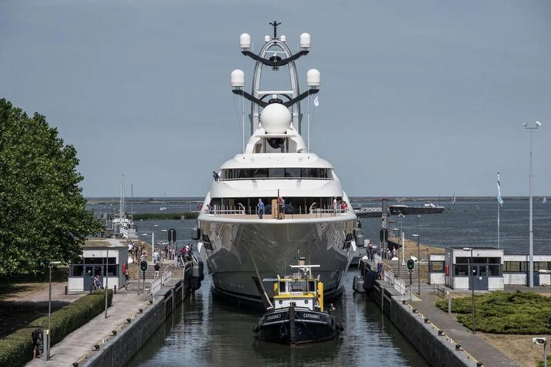 a large ship docked at a pier aboard AMBASSADOR Yacht for Sale