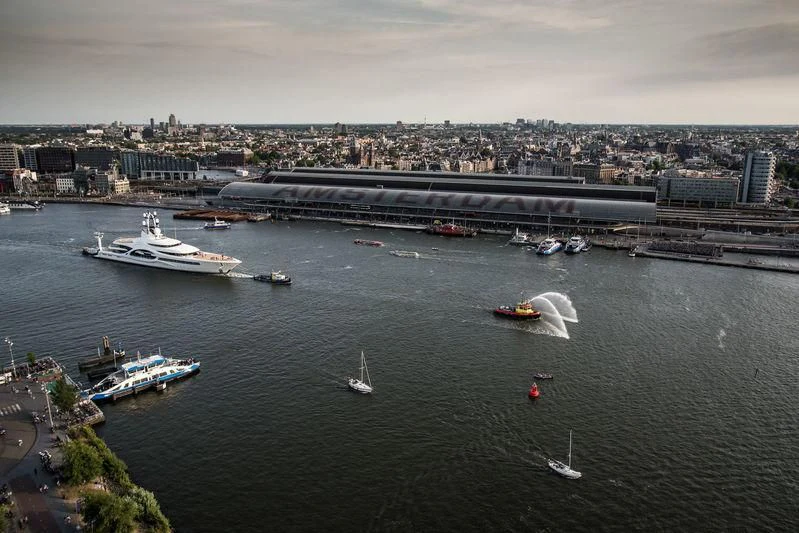 a body of water with boats and buildings along it aboard AMBASSADOR Yacht for Sale