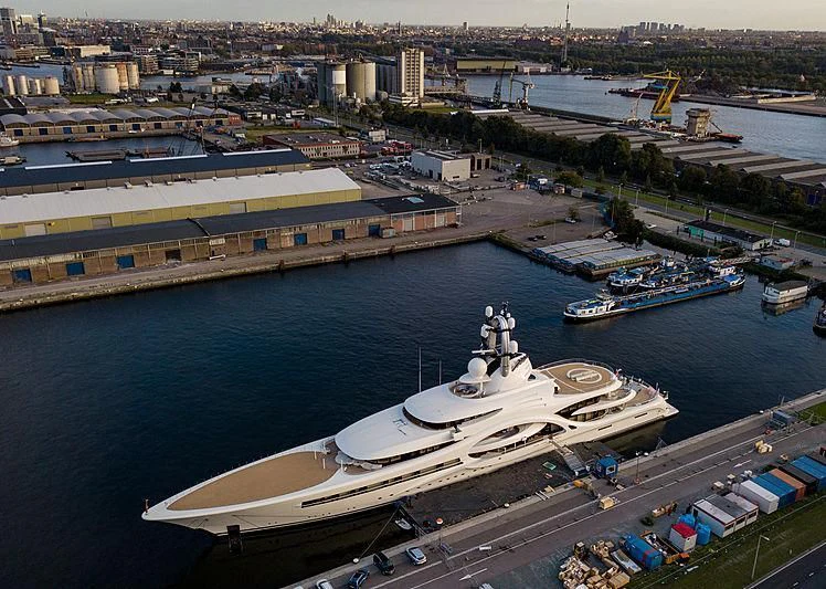 a large ship docked at a port aboard AMBASSADOR Yacht for Sale