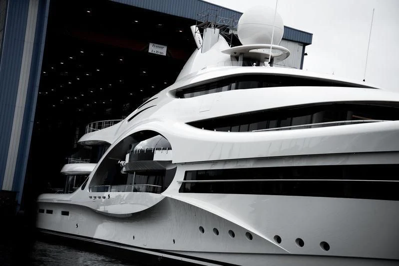 a white yacht in a dock aboard AMBASSADOR Yacht for Sale