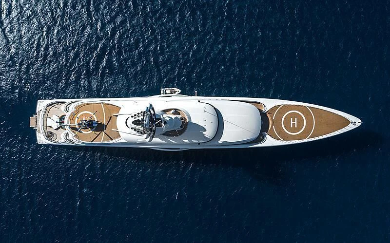 a pair of sunglasses on a blue surface aboard AMBASSADOR Yacht for Sale