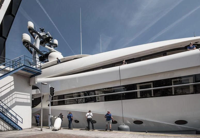 a building with people walking around aboard AMBASSADOR Yacht for Sale