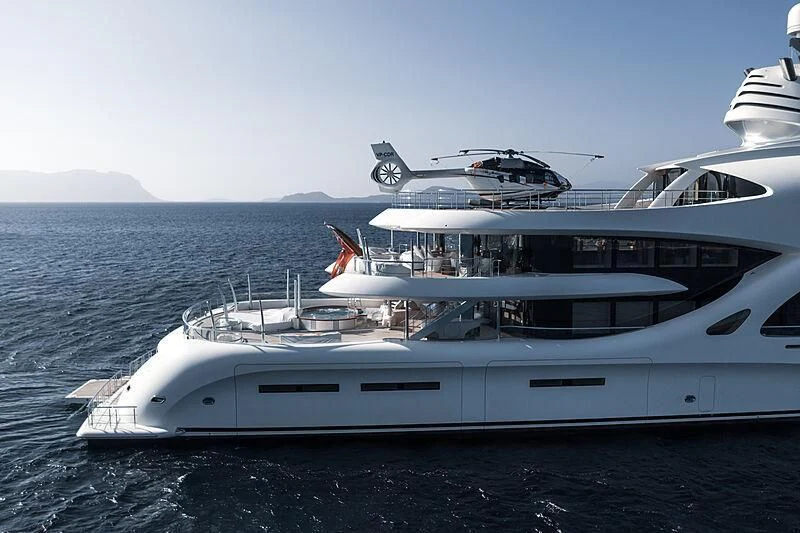 a boat with a helicopter on the back aboard AMBASSADOR Yacht for Sale