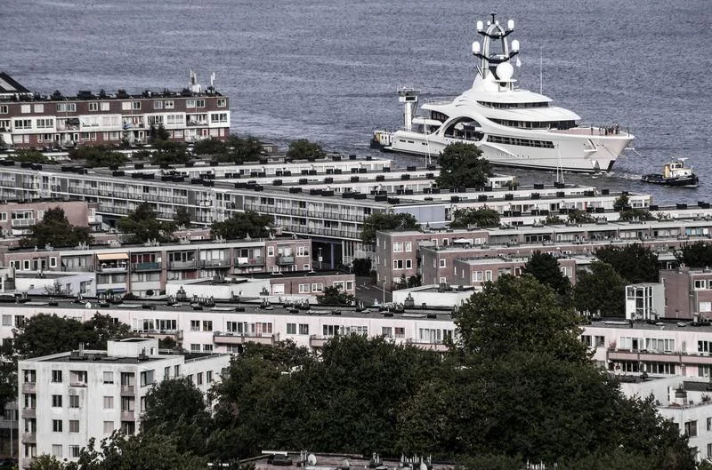 a helicopter flying over a city aboard AMBASSADOR Yacht for Sale