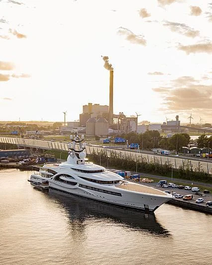 a large boat sits in a harbor aboard AMBASSADOR Yacht for Sale