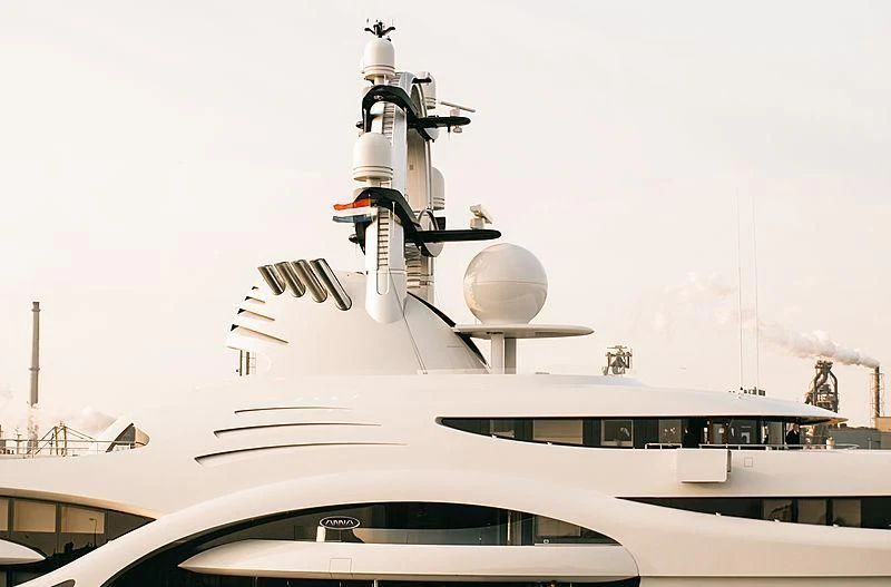 a large white ship with a satellite in the air aboard AMBASSADOR Yacht for Sale