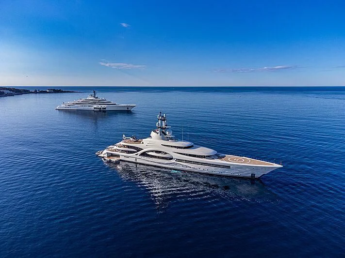 a couple of military boats in the water aboard AMBASSADOR Yacht for Sale