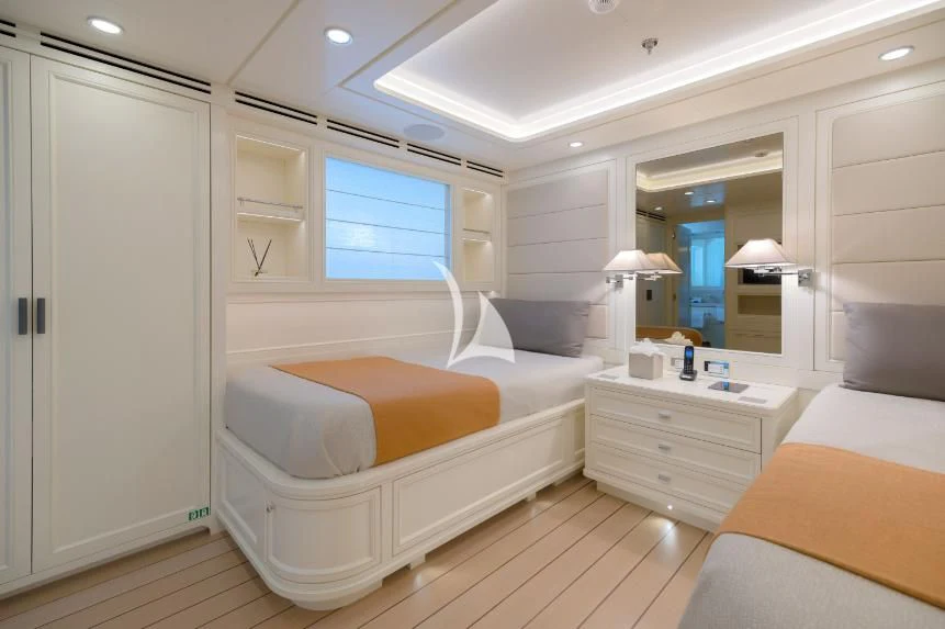 a room with a bed and a mirror aboard BOJI Yacht for Sale