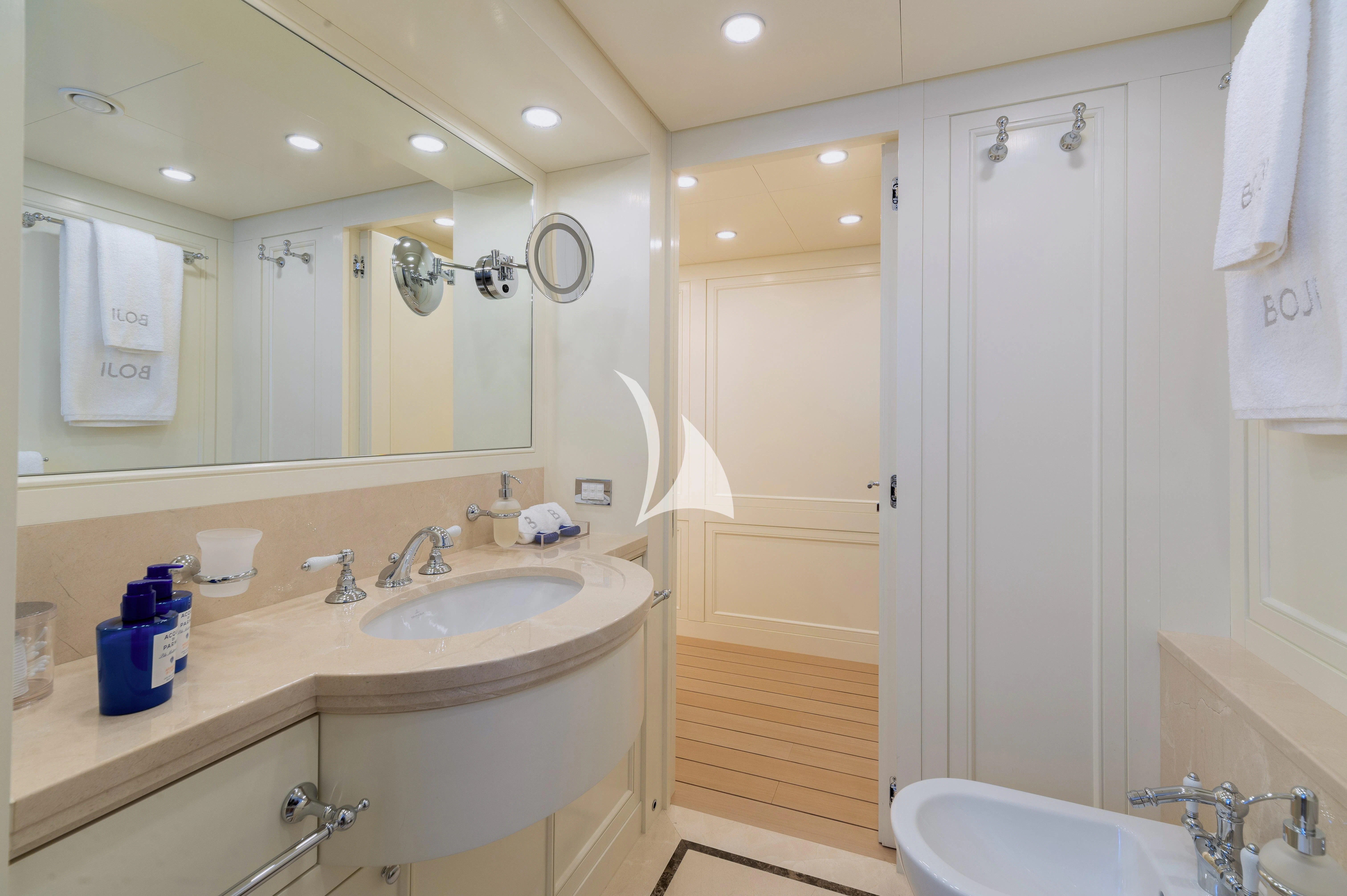 a bathroom with a sink and a mirror aboard BOJI Yacht for Sale