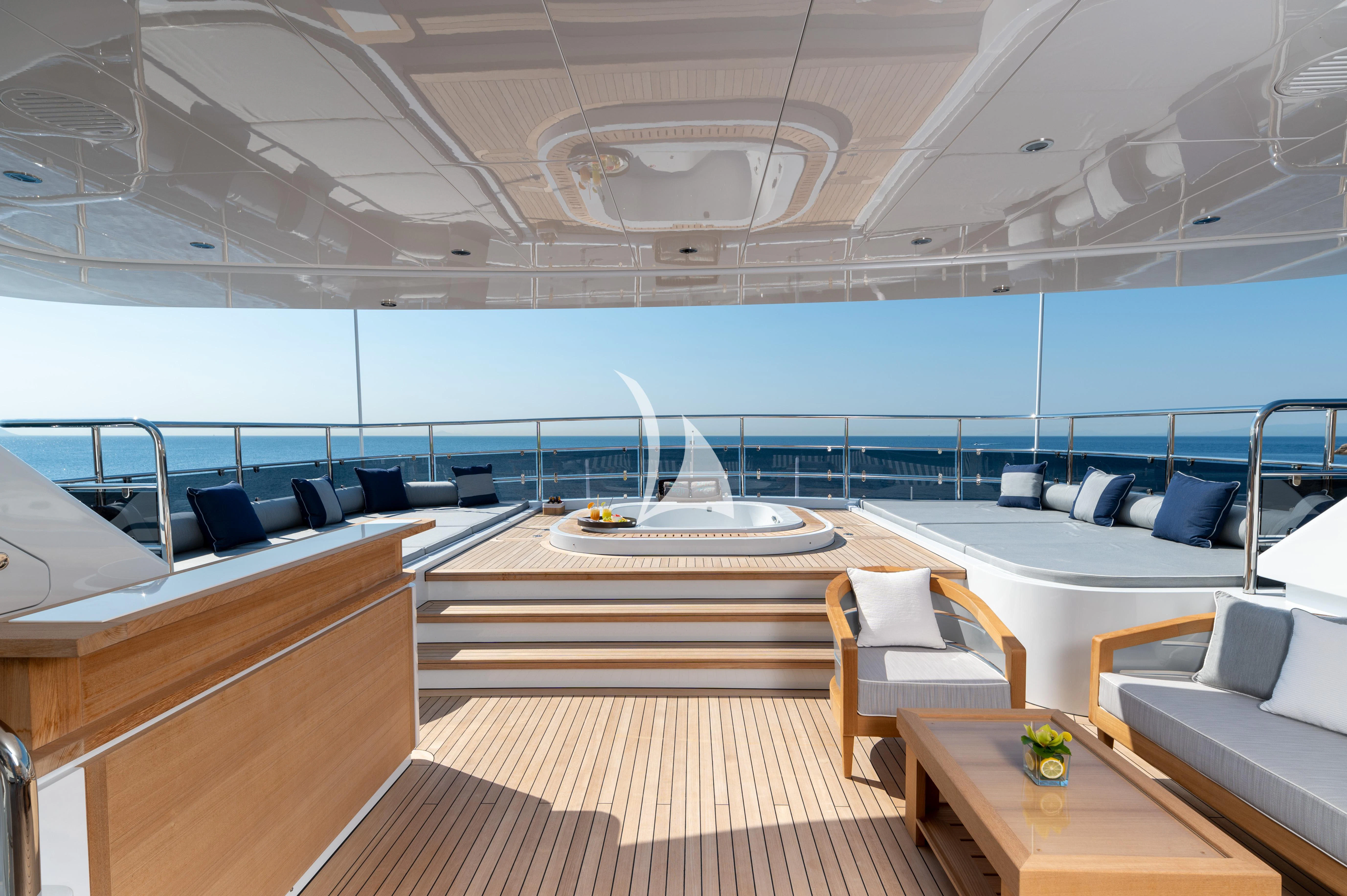 inside of a building with a large window and a table with chairs aboard BOJI Yacht for Sale
