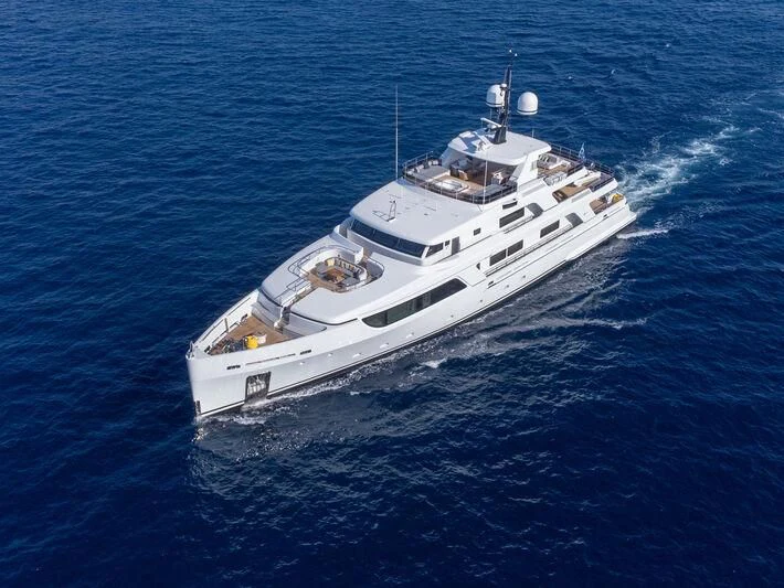 a white boat on the water aboard BOJI Yacht for Sale