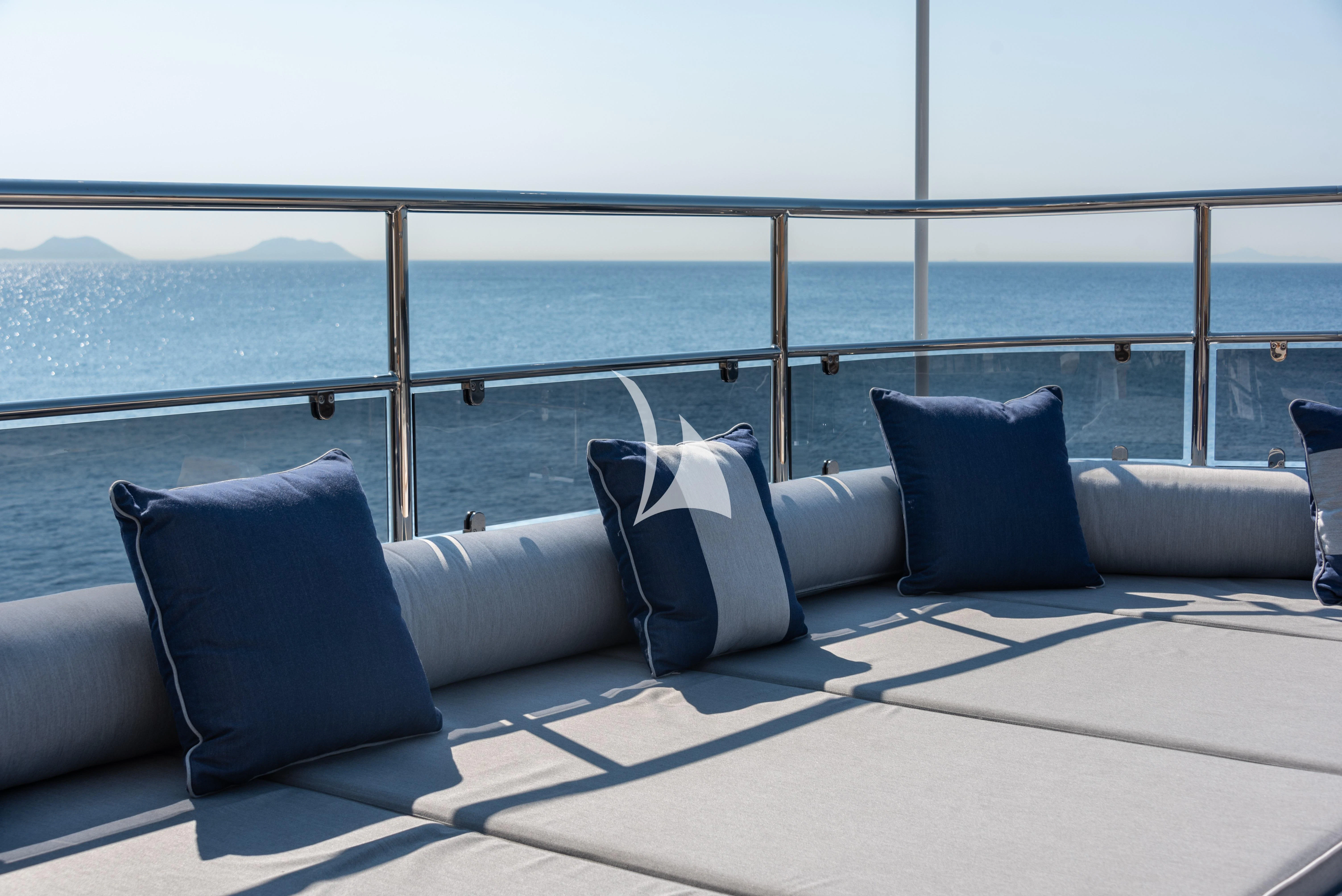 a bed with pillows on it aboard BOJI Yacht for Sale