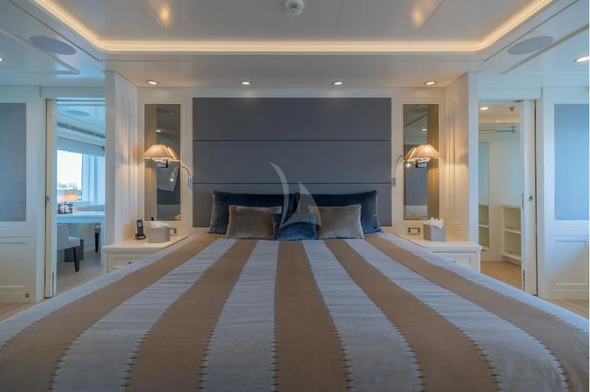 a large bed in a room aboard BOJI Yacht for Sale