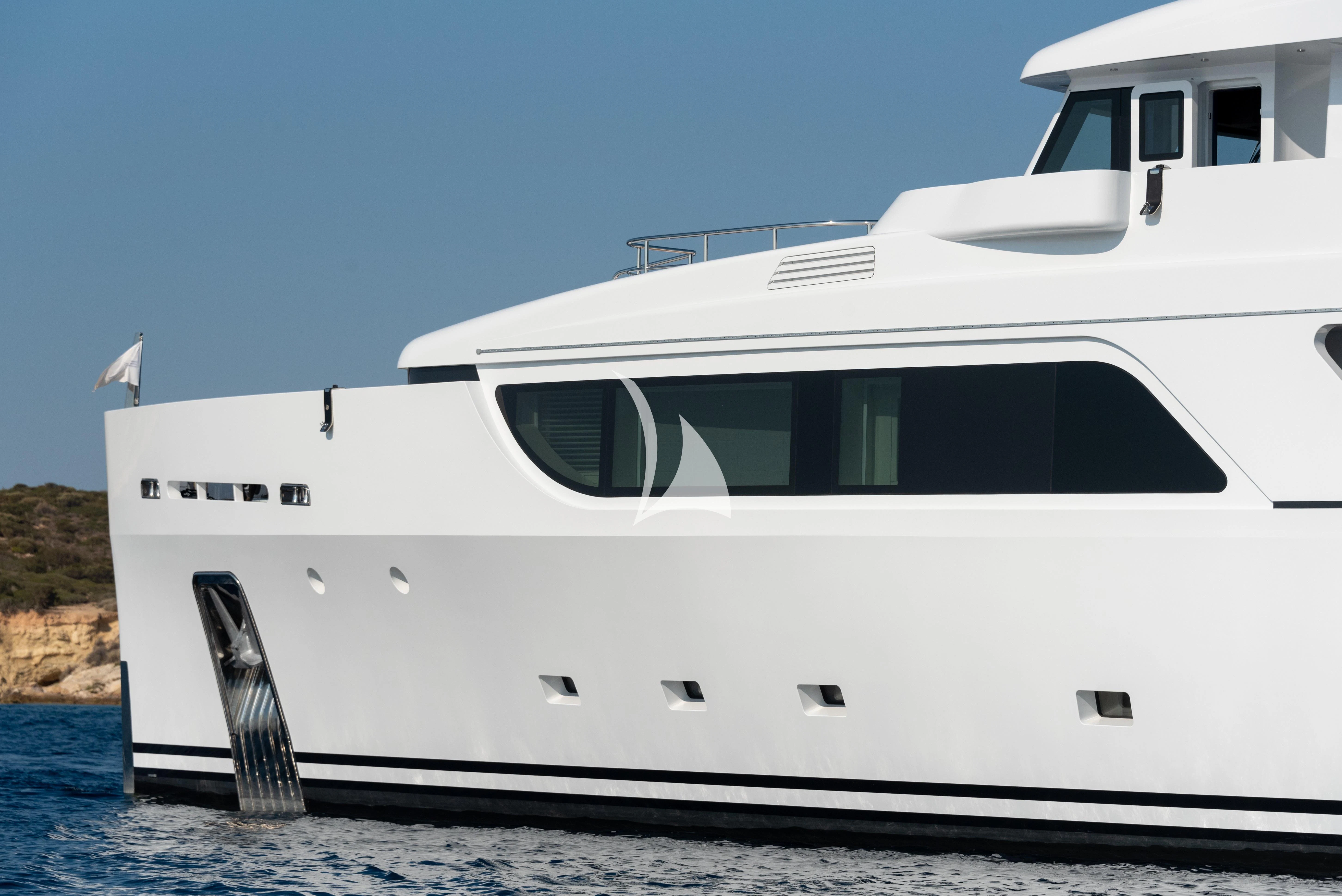 a white yacht on the water aboard BOJI Yacht for Sale