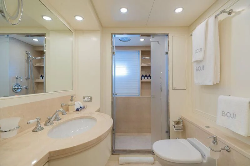 a bathroom with a sink and a shower unit aboard BOJI Yacht for Sale