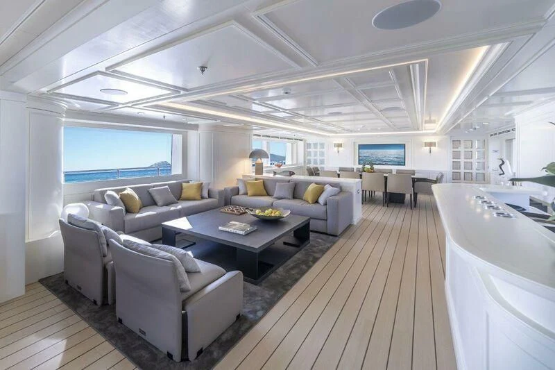a large living room with a large window aboard BOJI Yacht for Sale