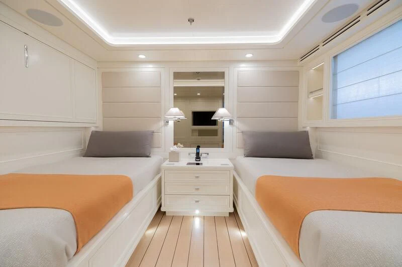 a room with a bed and a couch aboard BOJI Yacht for Sale