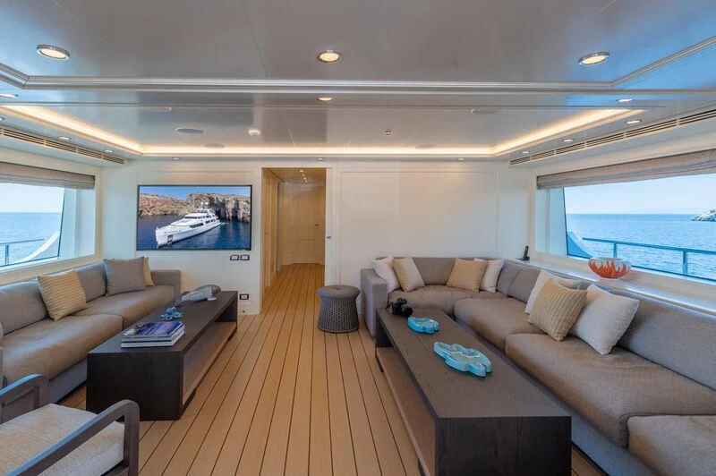 a living room with a wood floor aboard BOJI Yacht for Sale