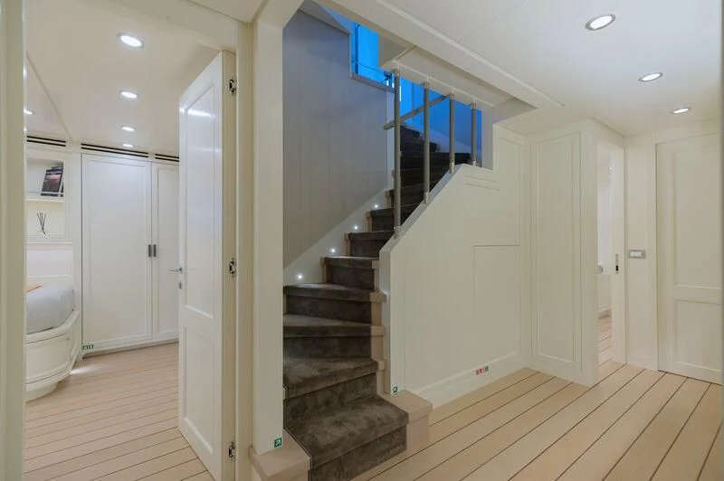a hallway with a staircase and doors aboard BOJI Yacht for Sale