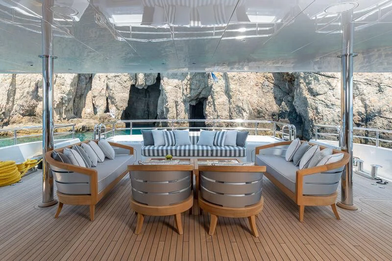 a room with a bed and a couch aboard BOJI Yacht for Sale