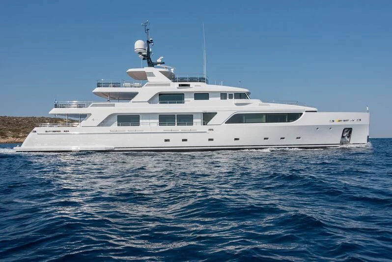 a white yacht on the water aboard BOJI Yacht for Sale