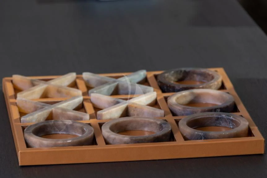 a wooden board with coins aboard BOJI Yacht for Sale