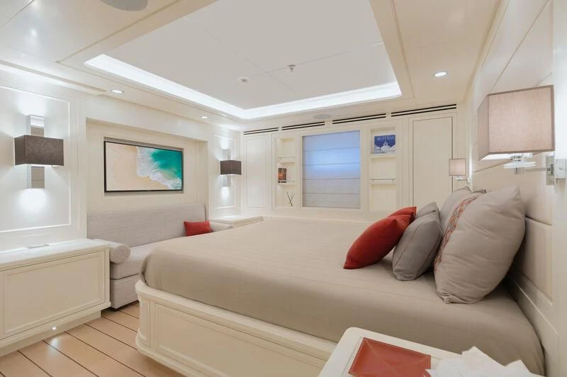 a living room with a large sofa aboard BOJI Yacht for Sale