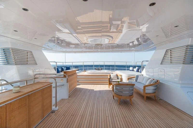 a large room with a large deck aboard BOJI Yacht for Sale
