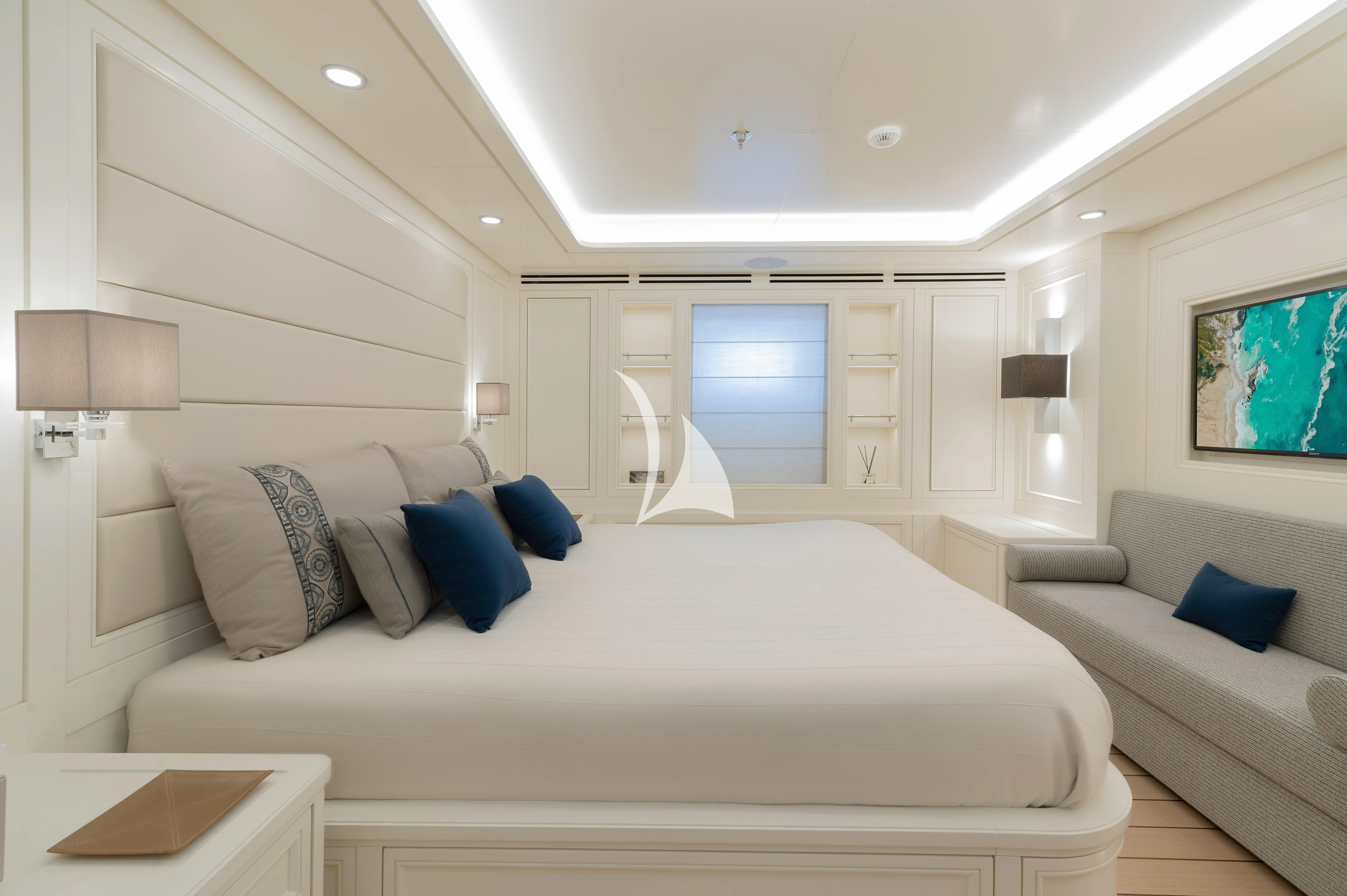 a large white bed in a room aboard BOJI Yacht for Sale