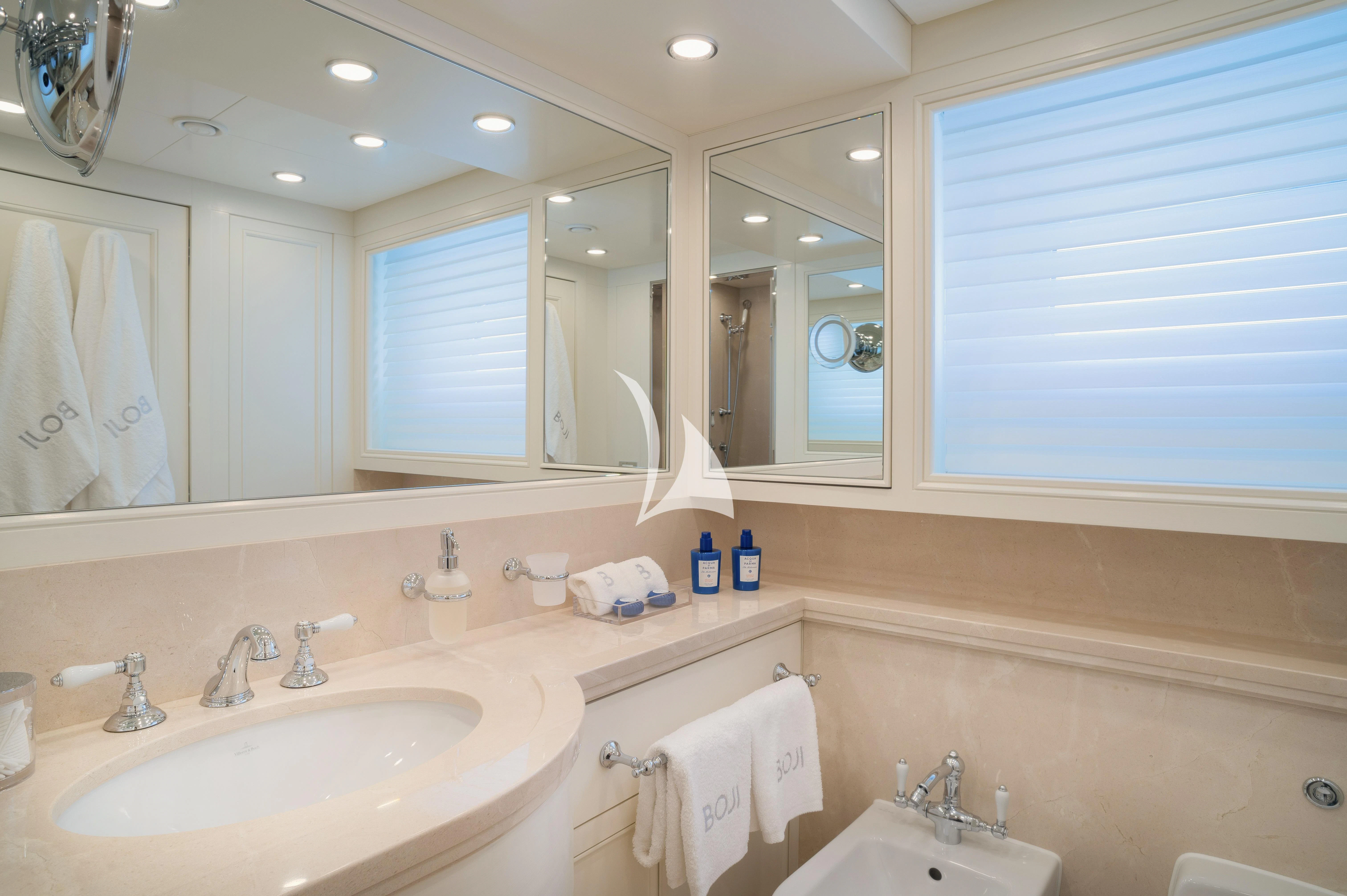 a bathroom with a large mirror aboard BOJI Yacht for Sale