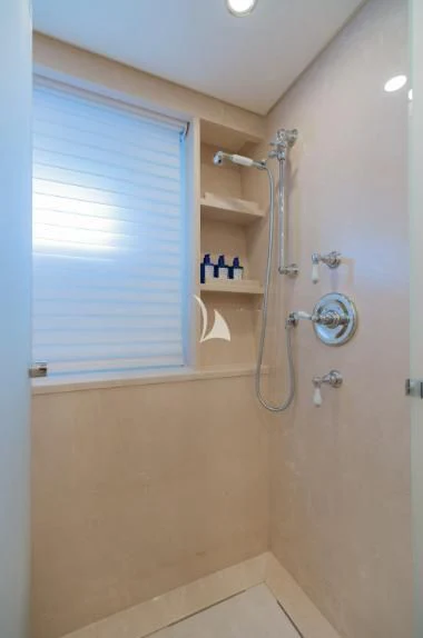 a bathroom with a shower and a sink aboard BOJI Yacht for Sale