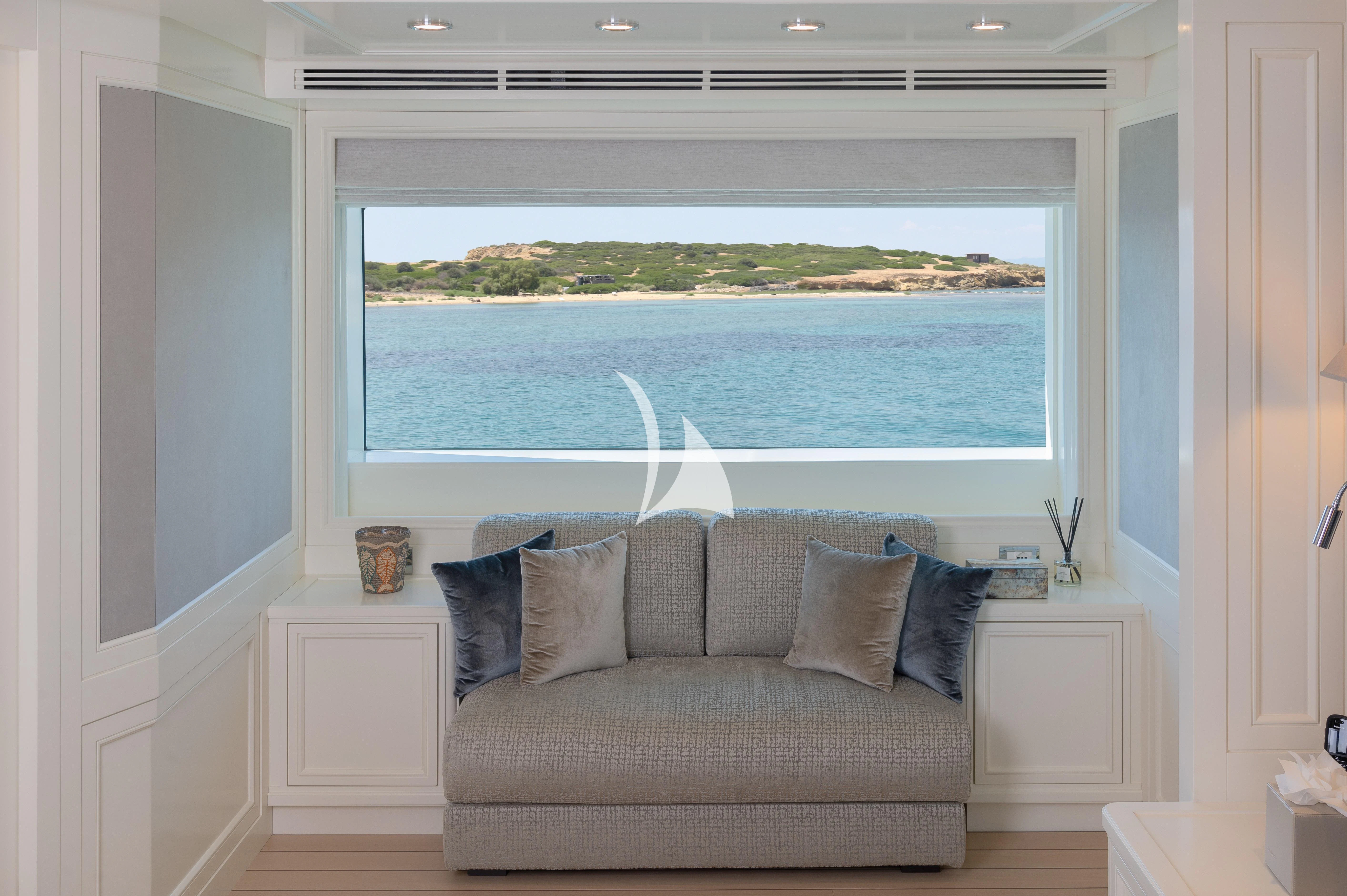 a couch in a room aboard BOJI Yacht for Sale