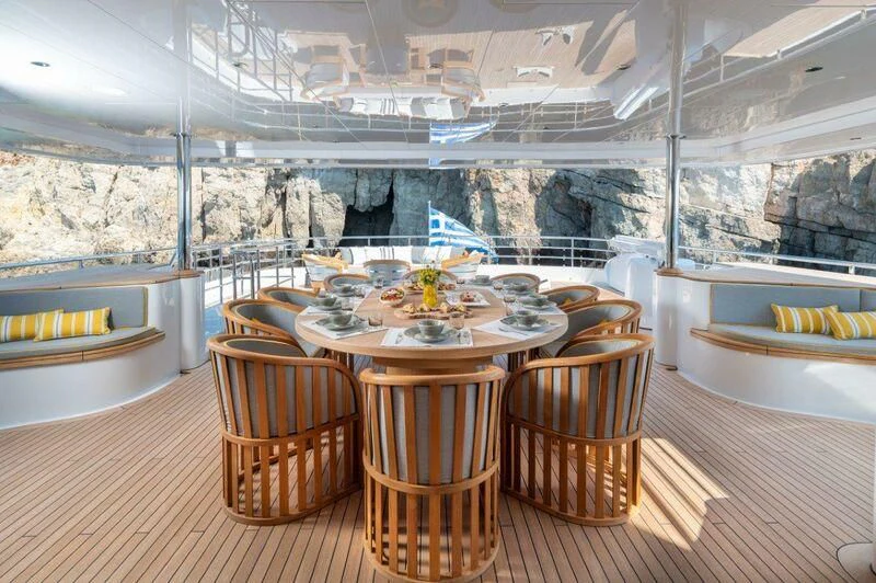 a table set for a meal aboard BOJI Yacht for Sale