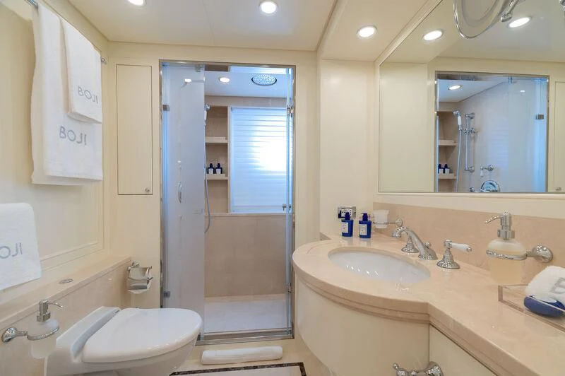 a bathroom with a sink and a shower aboard BOJI Yacht for Sale