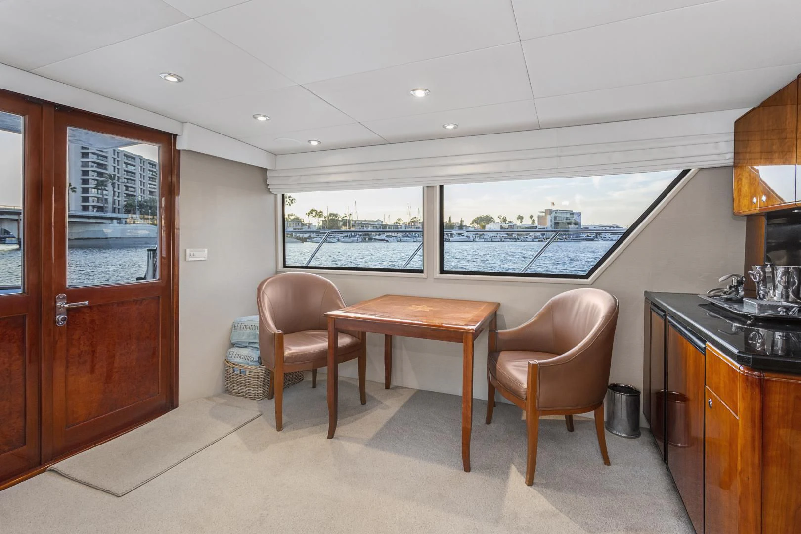 a room with a table and chairs aboard EL ENCANTO Yacht for Sale