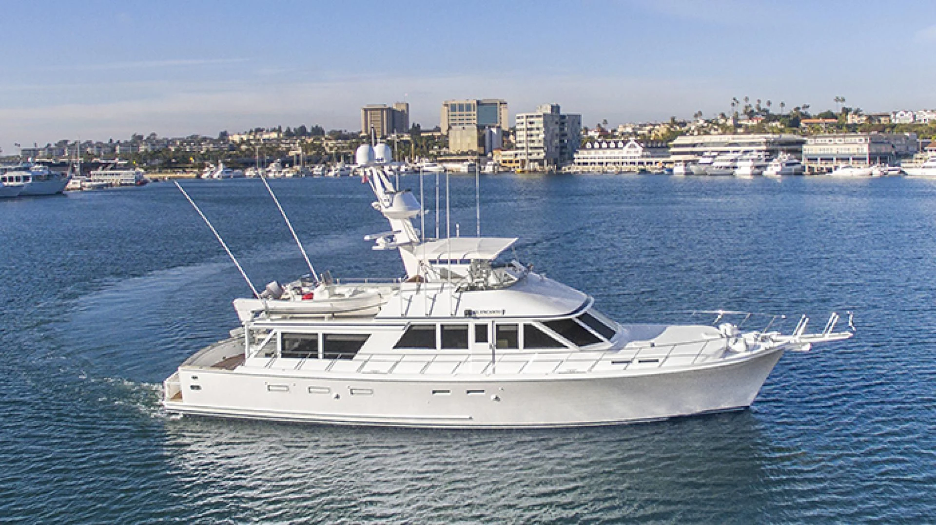 a white yacht in the water aboard EL ENCANTO Yacht for Sale