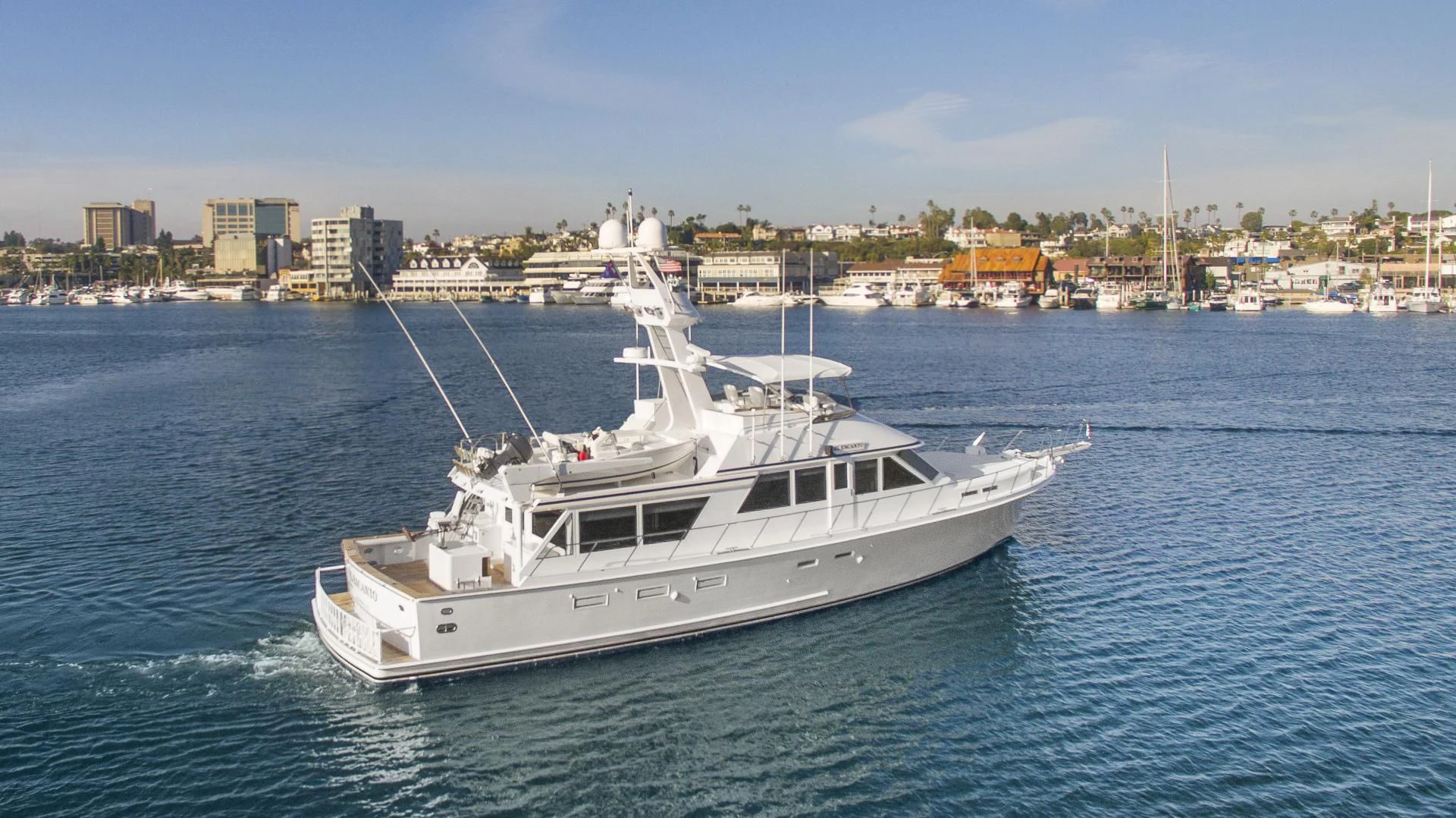 a white boat on the water aboard EL ENCANTO Yacht for Sale