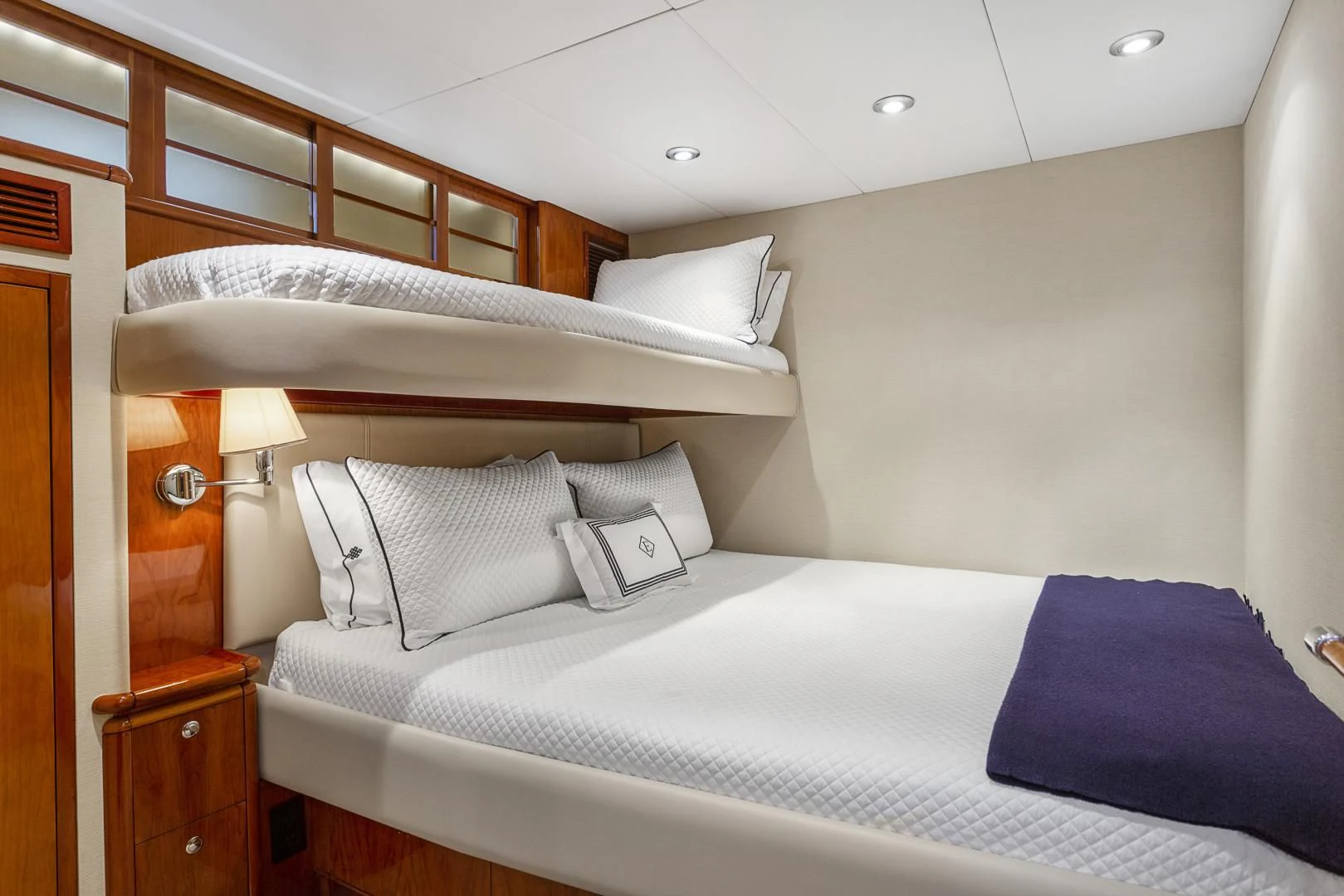 a bed with white sheets aboard EL ENCANTO Yacht for Sale
