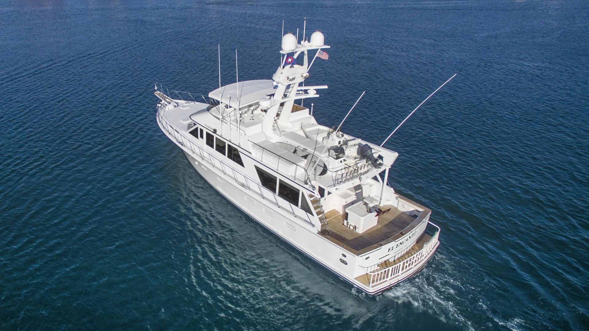 a large white ship in the water aboard EL ENCANTO Yacht for Sale