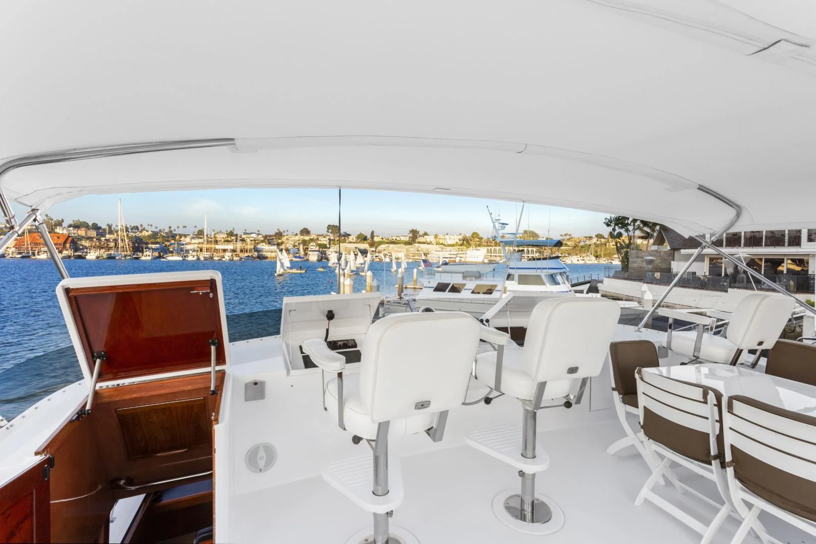 a white table and chairs on a boat aboard EL ENCANTO Yacht for Sale