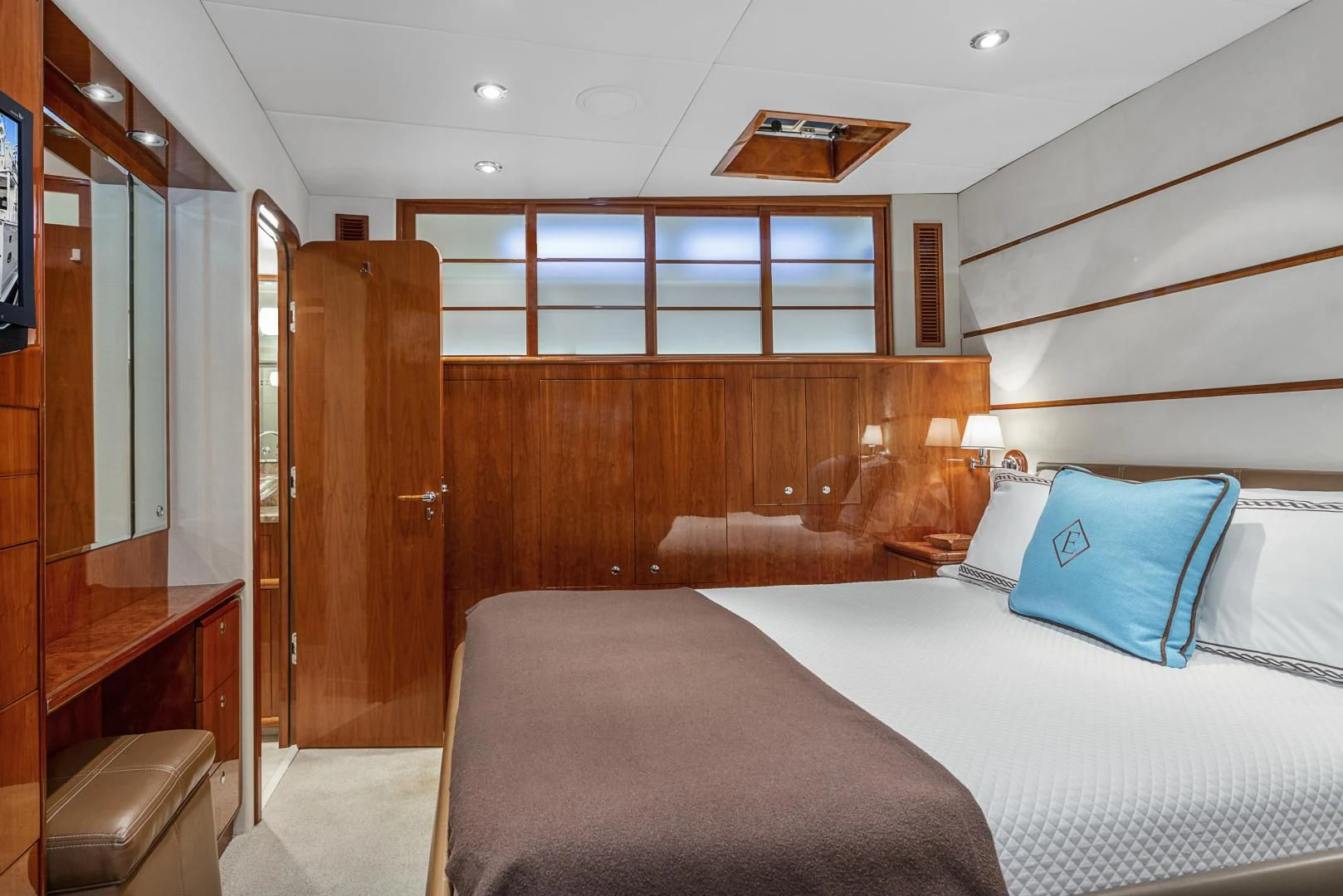 a room with a bed and a desk aboard EL ENCANTO Yacht for Sale