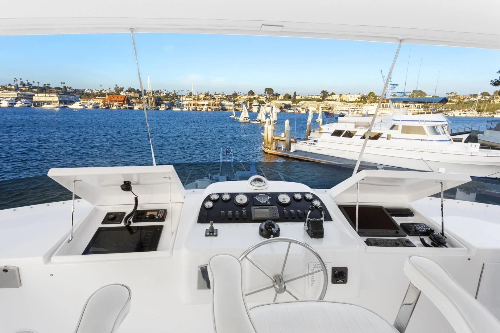 a white yacht in the water aboard EL ENCANTO Yacht for Sale