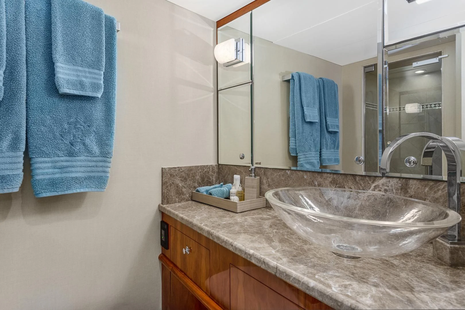 a bathroom with a large mirror aboard EL ENCANTO Yacht for Sale