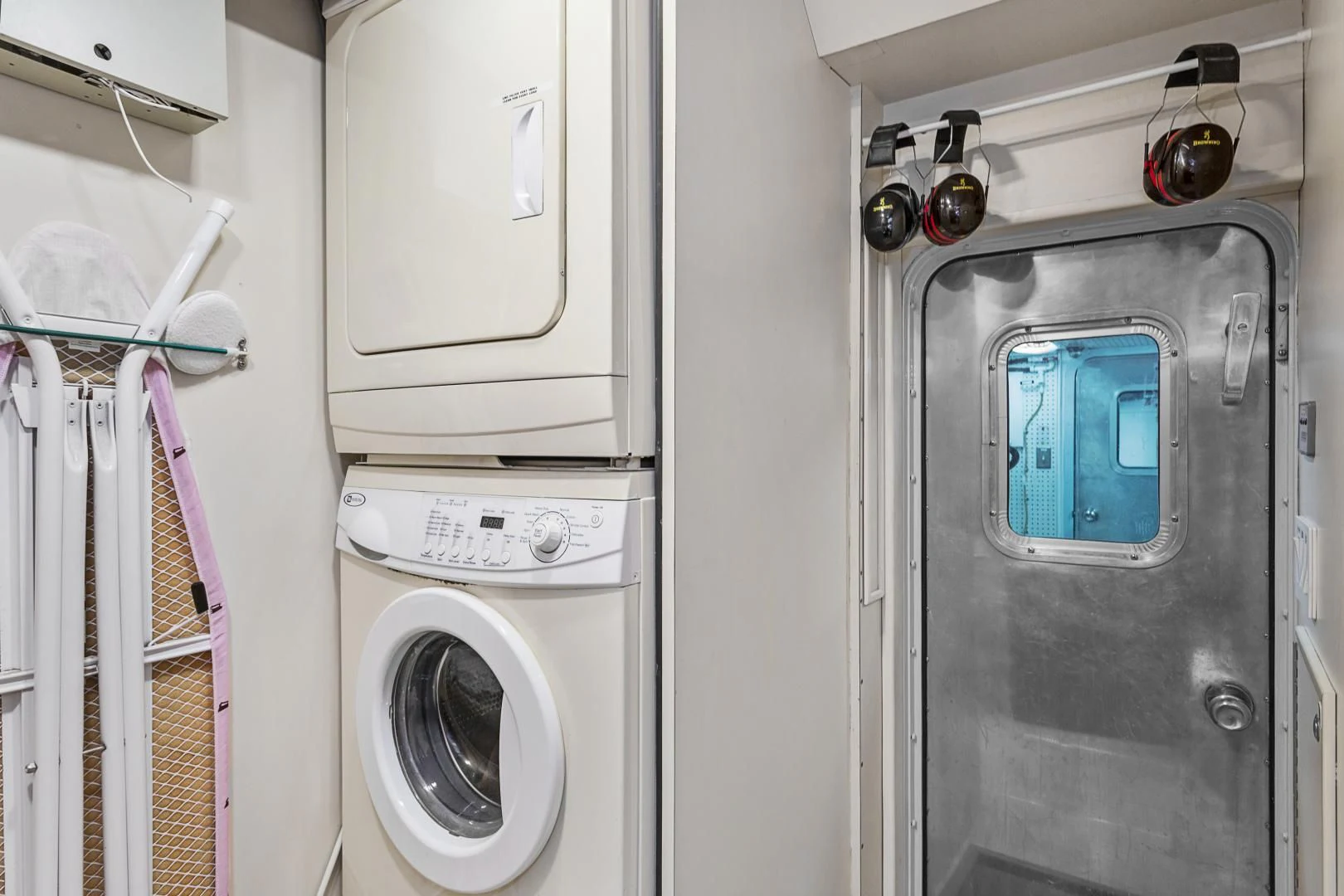 a washer and dryer in a room aboard EL ENCANTO Yacht for Sale