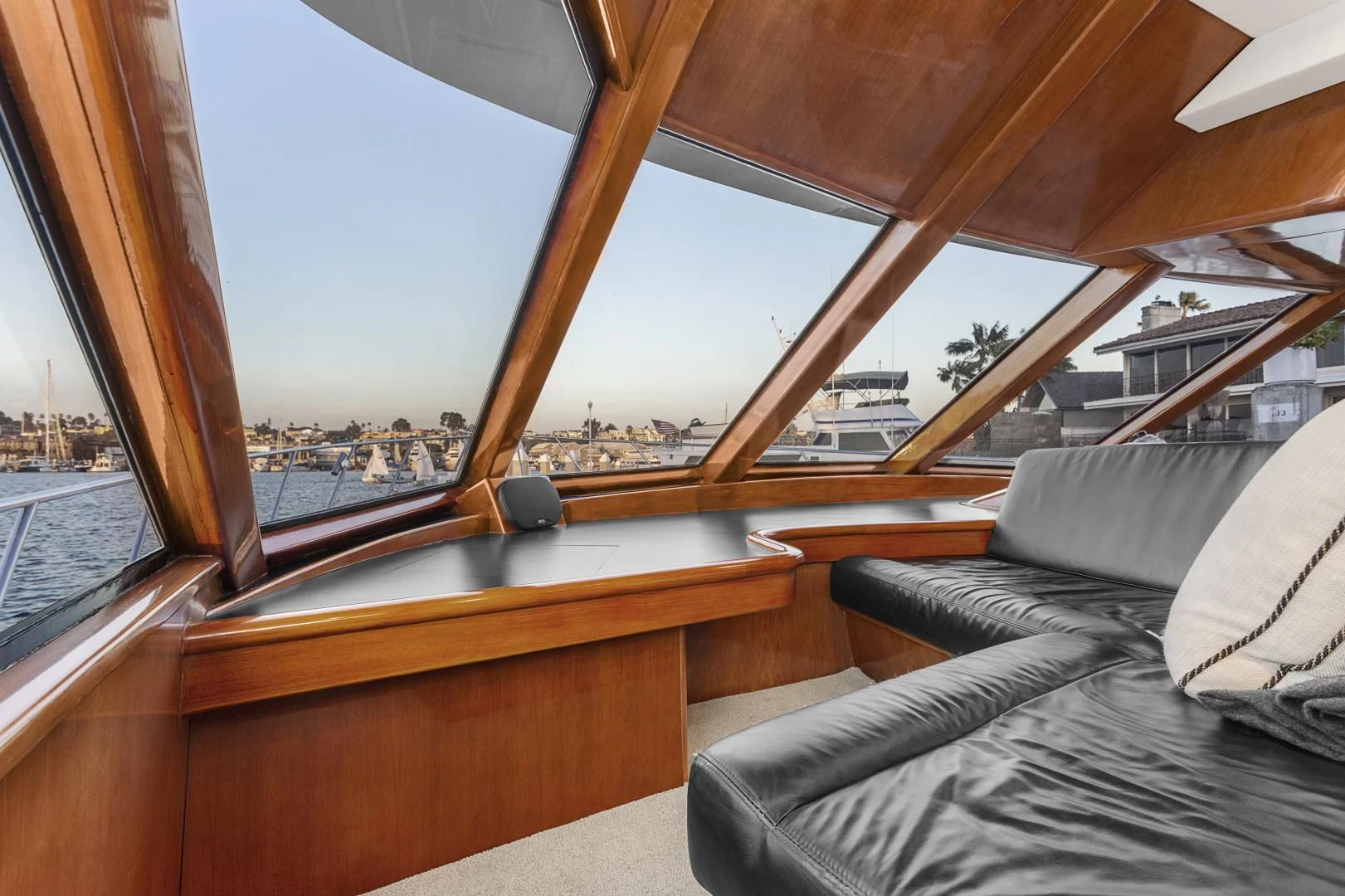 a room with a view of the water and a city aboard EL ENCANTO Yacht for Sale