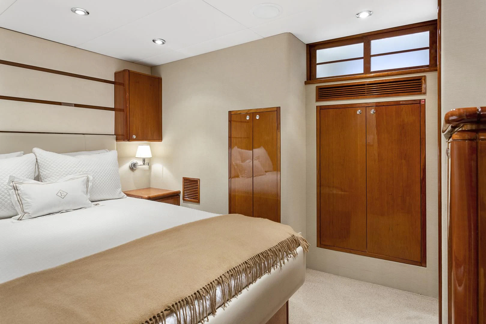 a hotel room with a bed and a closet aboard EL ENCANTO Yacht for Sale