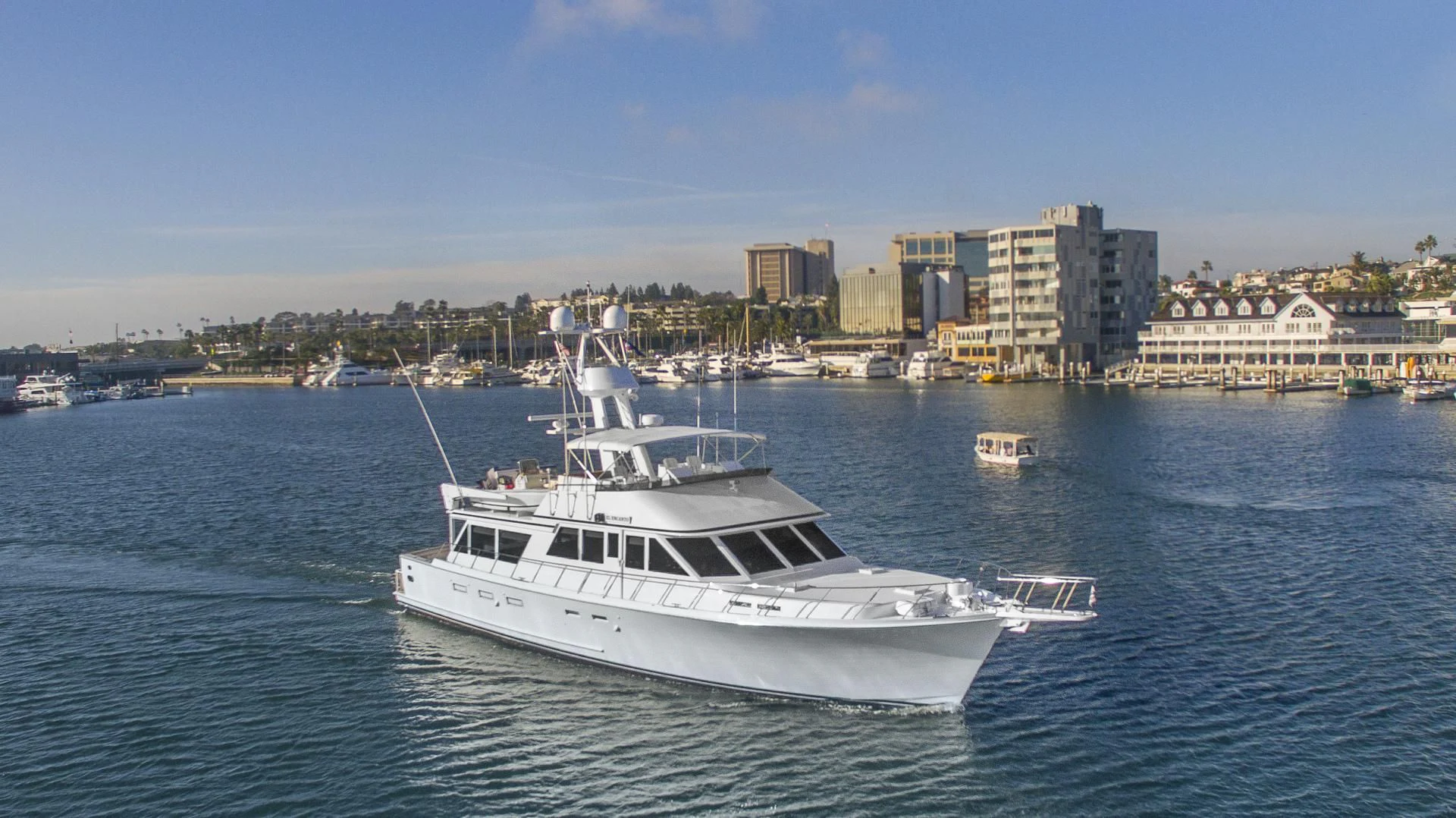 a white yacht in the water aboard EL ENCANTO Yacht for Sale