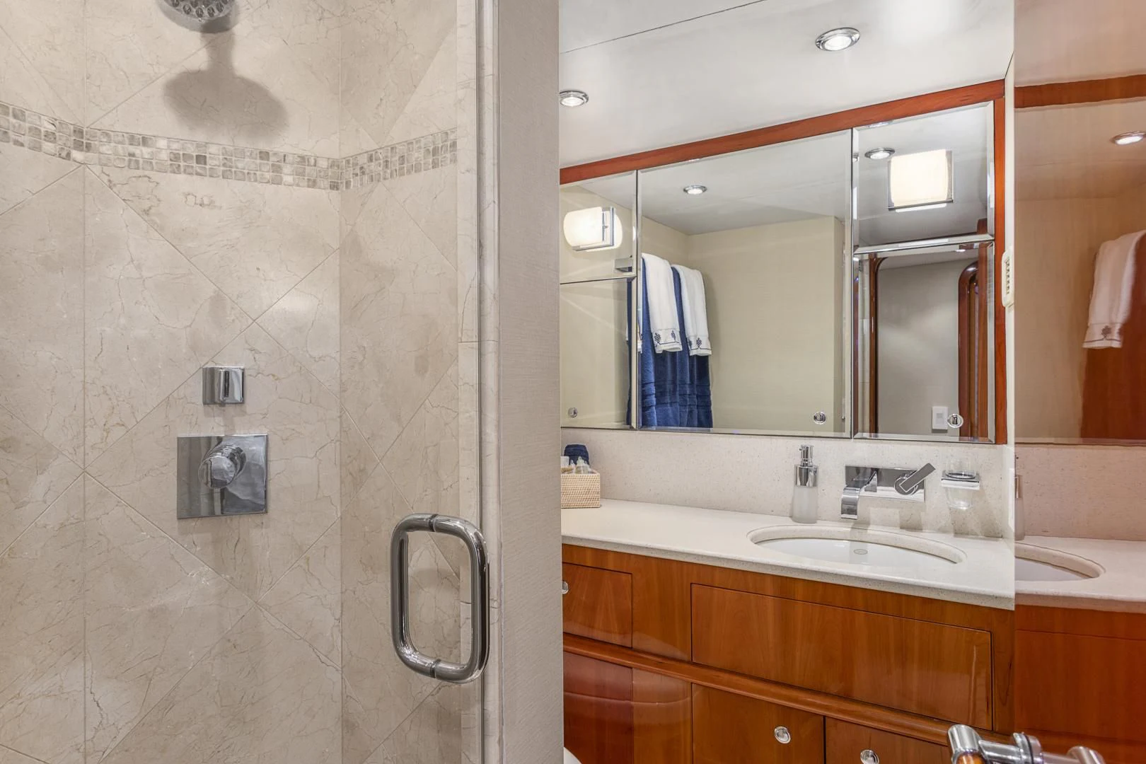 a bathroom with a large mirror aboard EL ENCANTO Yacht for Sale
