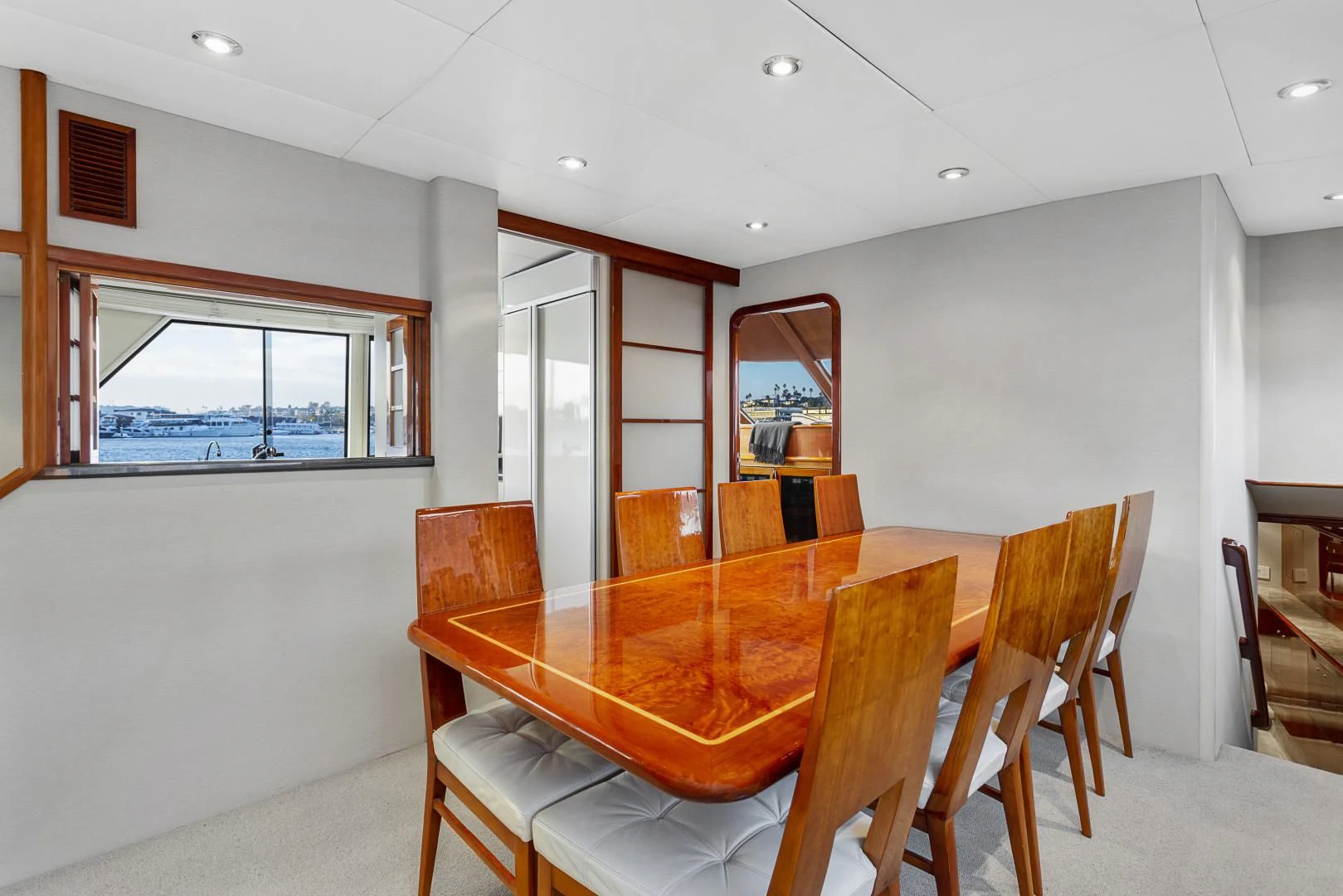 a dining table in a room aboard EL ENCANTO Yacht for Sale